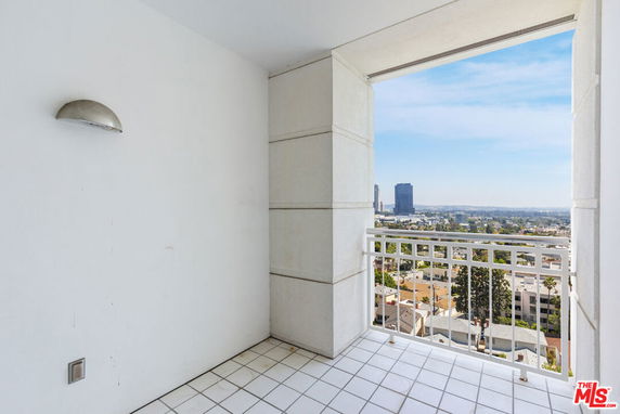 Elevated view from a balcony overlooking a cityscape.