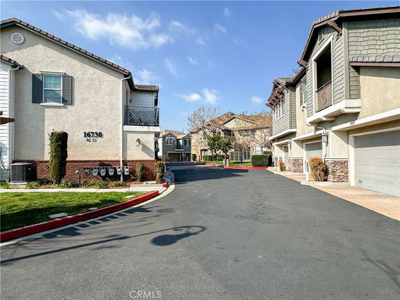Front view of multi-story residential buildings with garages.