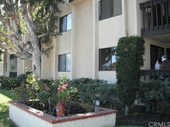 Exterior view of a multi-story building with balconies.