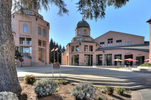 Front view of a building complex with City Hall and a Center for the Performing Arts.