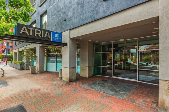 Front view of a building entrance labeled 'Atria' with glass doors.