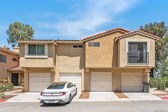 Front view of a two-story house with a double garage.