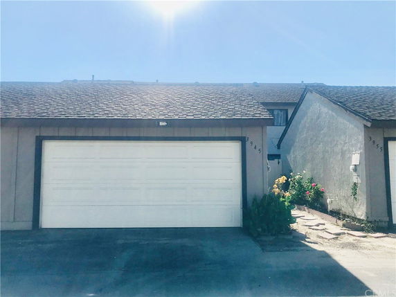 Front view of a two-story house with an attached double garage.