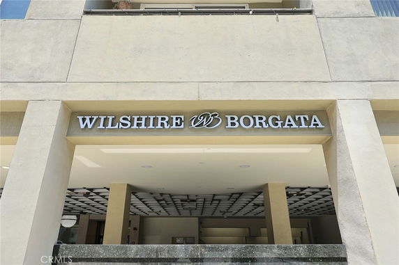 Front view of a building entrance with the sign 'Wilshire Borgata' above.