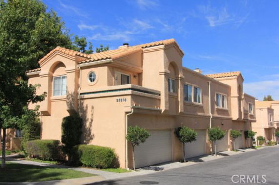 Front view of a two-story house with a double garage.