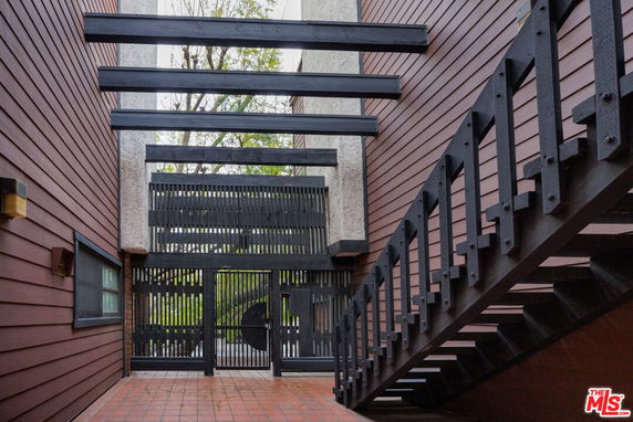 Wooden exterior with black beams and stairs