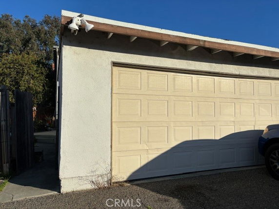 Front view of a garage with a single door.