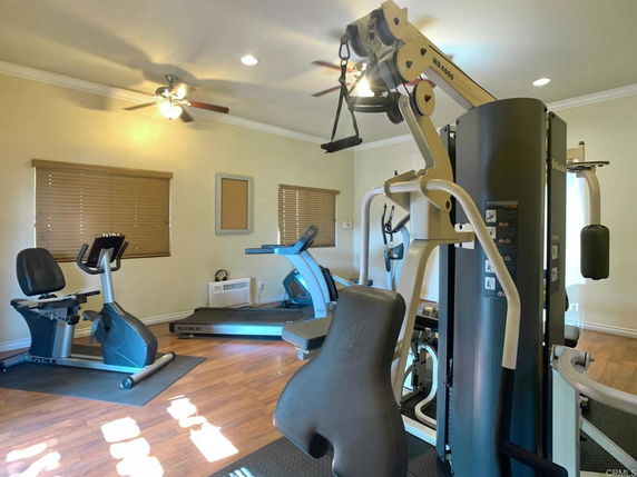 Indoor gym area with exercise equipment.