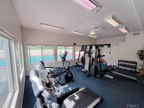Indoor gym area with exercise machines and weights