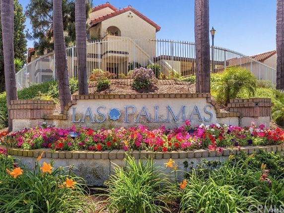 Front view of a building with a prominent sign reading 'Las Palmas.'