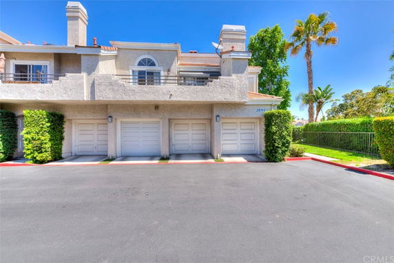 Front view of a two-story house with a three-car garage.