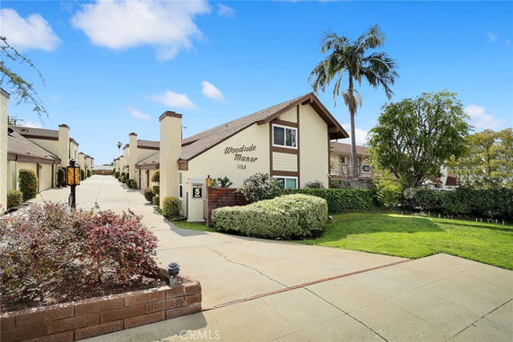 Front view of a multifamily residential complex with multiple units.