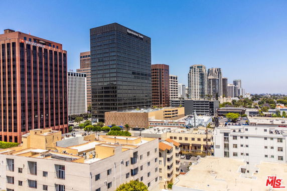 Panoramic view of a cityscape with multiple tall buildings.
