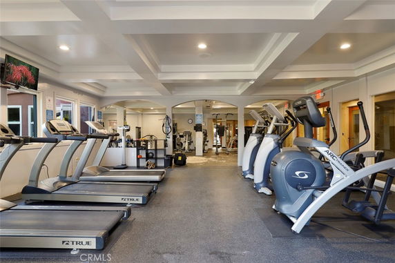 Indoor gym with treadmills and elliptical machines.
