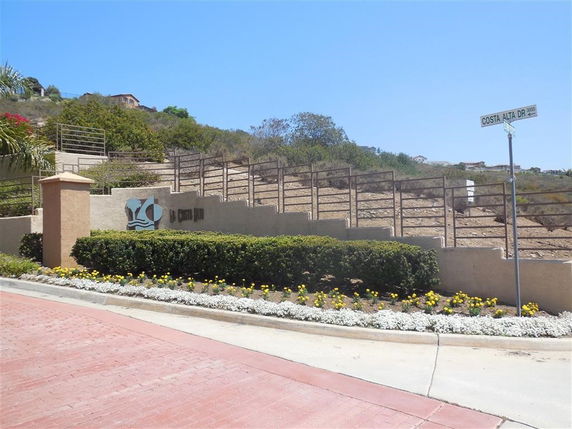 Landscape view with a road and hillside.