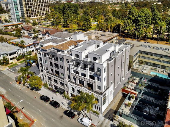 Elevation view of a multi-story apartment building with a modern design.