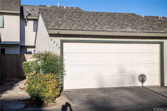 Front view of a two-story house with a double garage.