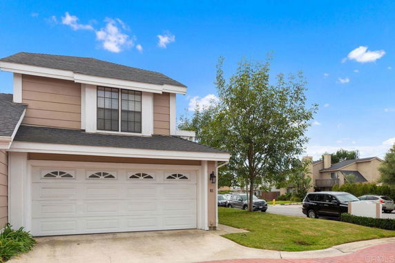 Front view of a two-story house with a double garage.