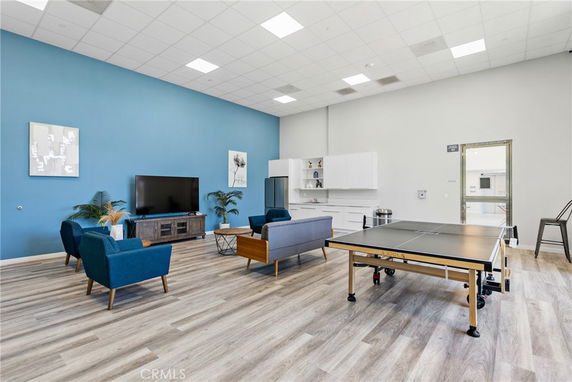 Indoor room with seating area and ping pong table.