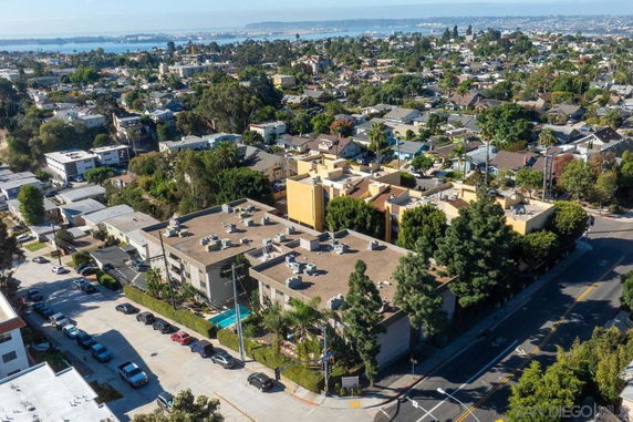 Aerial view of a residential area with multiple buildings and houses.