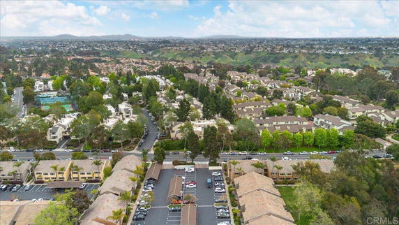 Panoramic view of a residential area with multiple buildings and greenery.
