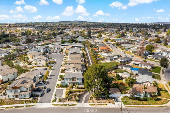Panoramic view of a residential neighborhood with multiple houses and streets.