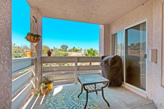Balcony view showing outdoor surroundings and landscape.