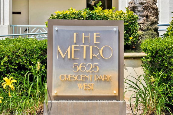 Front view of a building sign reading 'The Metro 5625 Crescent Park West'.