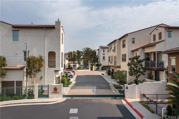 Front view of residential buildings in a gated community.