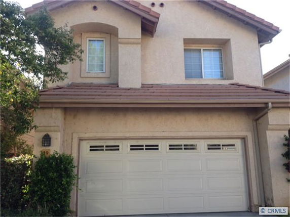 Front view of a two-story house with a double garage.