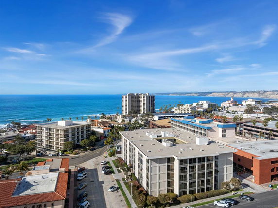 Panoramic view of coastal buildings and ocean in the background.