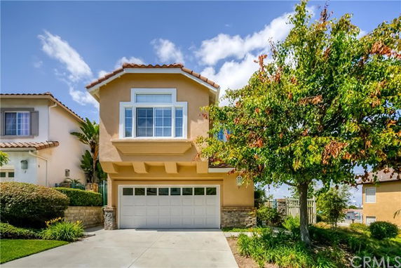 Front view of a two-story house with a double garage.