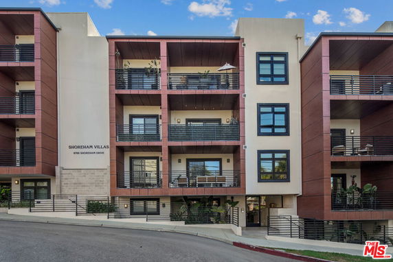 Front view of a multi-story apartment building named Shoreham Villas.
