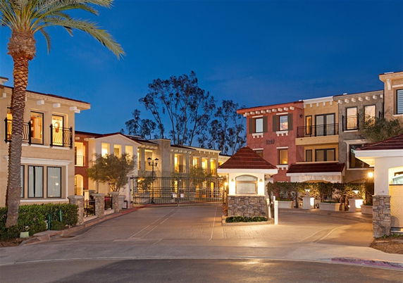 Front view of a multi-story residential complex with balconies.