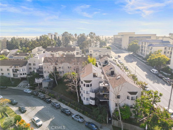 Aerial view of a residential area with multiple buildings and streets.