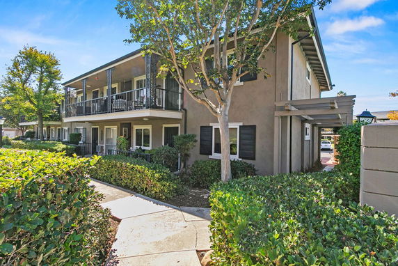Front view of a two-story residential building with balconies.