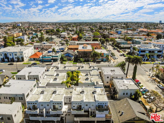 Aerial view of a residential neighborhood with multiple buildings and streets.