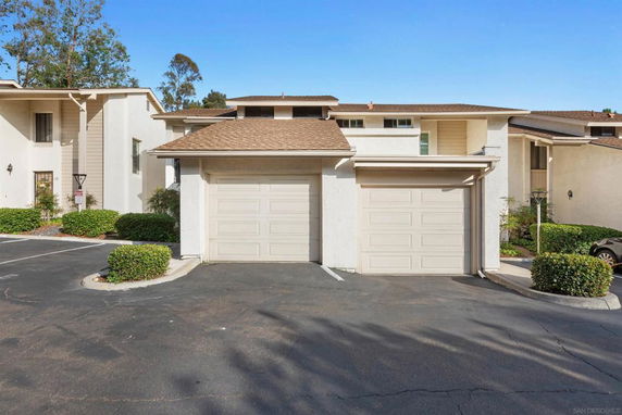 Front view of a two-story house with attached garage.