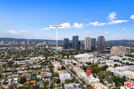 Panoramic view of a cityscape with tall buildings and residential area.