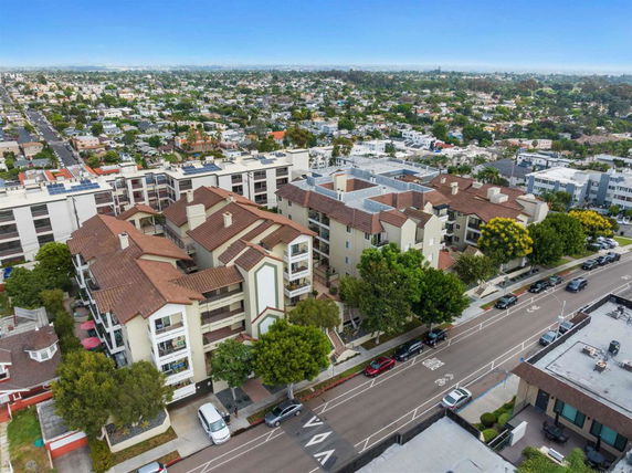 Aerial view of a residential area with multiple multi-story apartment buildings and roads.