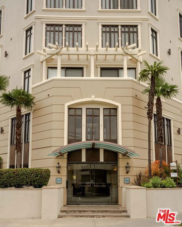 Front view of a multi-story building with a modern entrance.