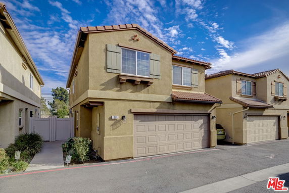 Front view of a two-story house with a double garage.
