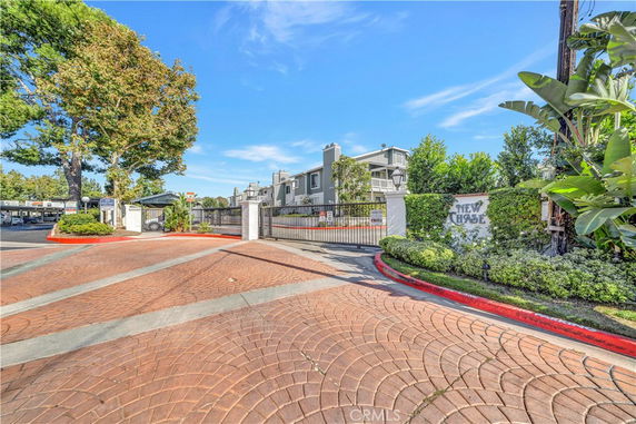 Front view of a gated residential building complex.