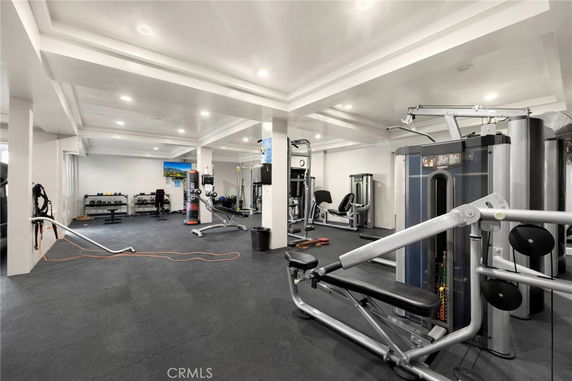 Indoor gym with various exercise equipment.