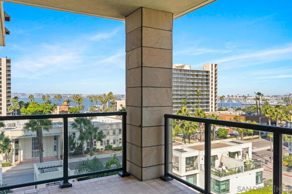 View of surrounding cityscape and waterfront from a balcony.
