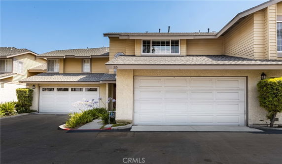 Front view of a two-story house with double garage.