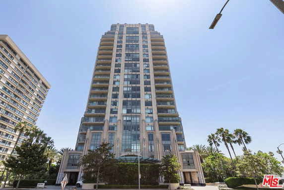 Front view of a high-rise building with multiple balconies