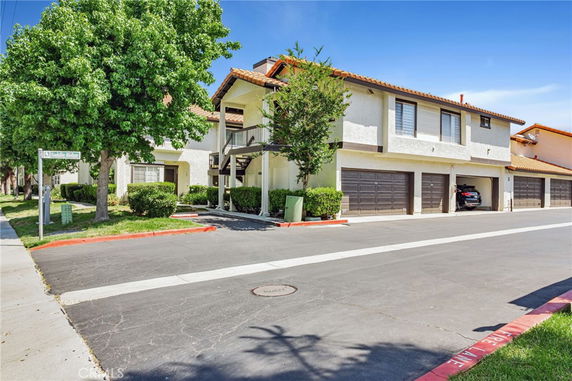Front view of a two-story house with multiple garages.