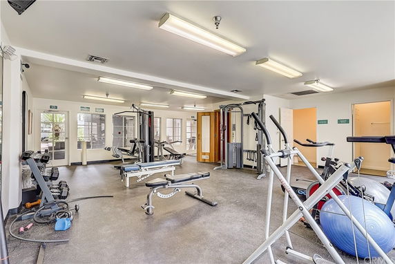 Indoor gym area with exercise equipment and fitness machines.