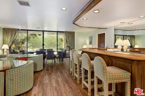 Interior view of a clubhouse with seating area and bar counter.